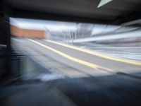 the train station is moving through motion blurry as if it was a train at the station