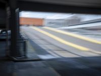 the train station is moving through motion blurry as if it was a train at the station