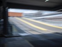 the train station is moving through motion blurry as if it was a train at the station