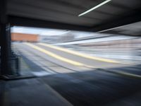 the train station is moving through motion blurry as if it was a train at the station