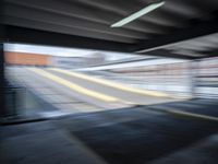 the train station is moving through motion blurry as if it was a train at the station