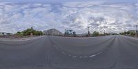 a reflection view of an empty city street from a fish eye lens, which is shaped like a highway