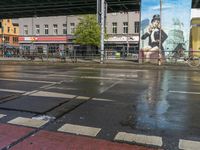 a city bus is driving under a bridge above water, and another bus rides under the bridge