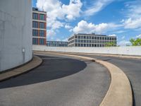 a car is driving on the highway through an underground parking garage area in a city