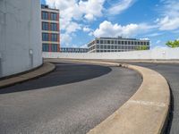 a car is driving on the highway through an underground parking garage area in a city