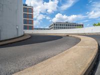 a car is driving on the highway through an underground parking garage area in a city