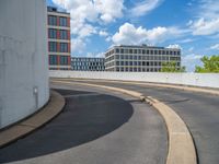 a car is driving on the highway through an underground parking garage area in a city