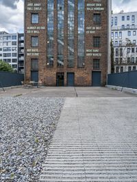 a brick building that is on the ground with signs attached to it on it's side