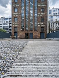 a brick building that is on the ground with signs attached to it on it's side