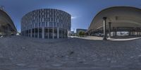 a fish eye lens lensing an architecture and building with a clock tower in the background