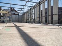 inside of an industrial building that has white paint on the floor and white wall with green lines