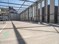 inside of an industrial building that has white paint on the floor and white wall with green lines