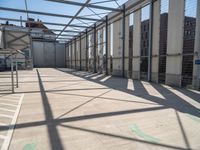 inside of an industrial building that has white paint on the floor and white wall with green lines