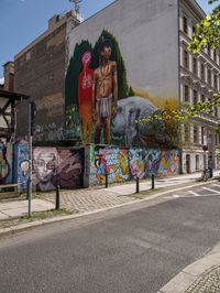 a mural of a person is on the wall of an old building with graffiti in it