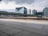 a bridge crosses over a river in the middle of buildings on either side of it