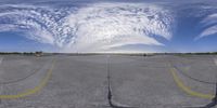 an empty parking lot is shown in this circular image - one is reflecting the sky and two have cars at their