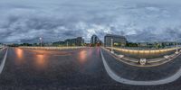 a 360 - view image of a large city street lit up in bright evening lights