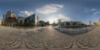 a photo with a fish eye lens on the street and houses in the background, on the left side