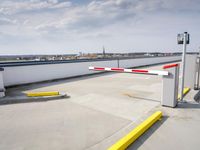 a boat is parked in an empty parking lot near an air port on the water