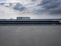 a boat is parked in an empty parking lot near an air port on the water