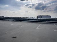 a boat is parked in an empty parking lot near an air port on the water