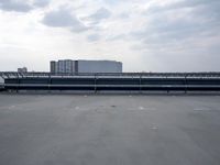 a boat is parked in an empty parking lot near an air port on the water