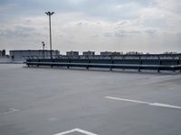 a boat is parked in an empty parking lot near an air port on the water