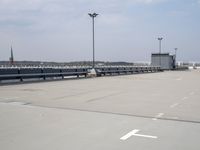 a boat is parked in an empty parking lot near an air port on the water