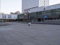 the empty space between two buildings that look like a city square for pedestrians to enjoy