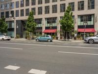 the white lines are painted on the street in front of buildings with stores and restaurants