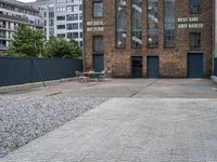 the street is full of cobblestone tiles as a building stands next to it