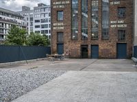 the street is full of cobblestone tiles as a building stands next to it