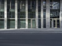 this is an image of a modern building on a city street with empty streets in the foreground