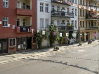 an image of city street that looks really narrow and empty looking outside from a balcony