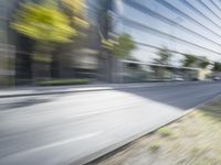 a view of a city street from a moving car lens with a blurry background