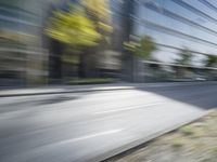 a view of a city street from a moving car lens with a blurry background