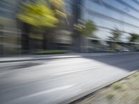 a view of a city street from a moving car lens with a blurry background