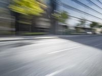 a view of a city street from a moving car lens with a blurry background