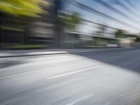 a view of a city street from a moving car lens with a blurry background