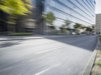 a view of a city street from a moving car lens with a blurry background