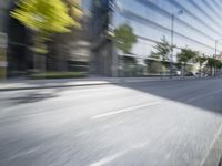 a view of a city street from a moving car lens with a blurry background