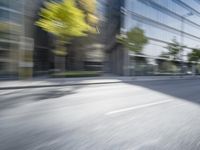 a view of a city street from a moving car lens with a blurry background