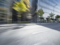 a view of a city street from a moving car lens with a blurry background