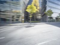 a view of a city street from a moving car lens with a blurry background