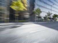 a view of a city street from a moving car lens with a blurry background