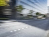 a view of a city street from a moving car lens with a blurry background