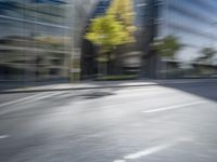 a view of a city street from a moving car lens with a blurry background