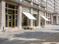 the side walk has awnings on two sides that allow shade to the sidewalk