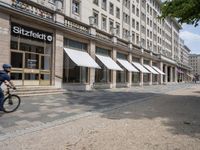 the side walk has awnings on two sides that allow shade to the sidewalk