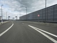 a freeway with two lanes in between the buildings and there is no traffic to see